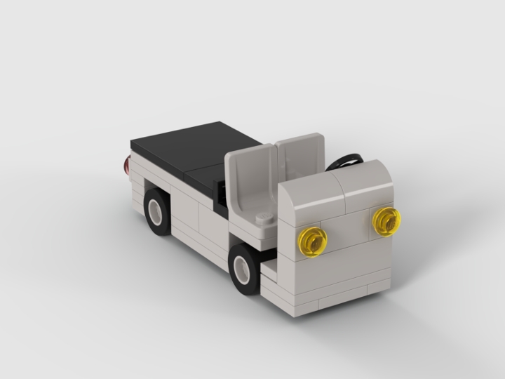 Front three-quarter Stud.io render of the IndyCar pit cart MOC showing yellow headlights, open equipment bed, and black top canopy