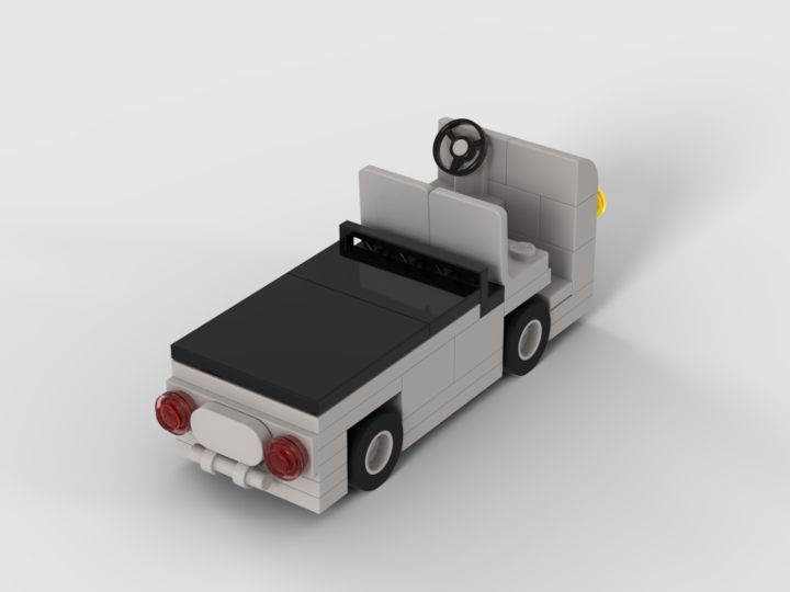 Rear three-quarter Stud.io render of the IndyCar pit cart MOC showing red taillights, steering wheel, and open cab design